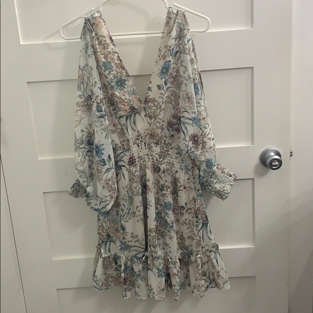 Floral dress. Openish sleeves and back. NWT.